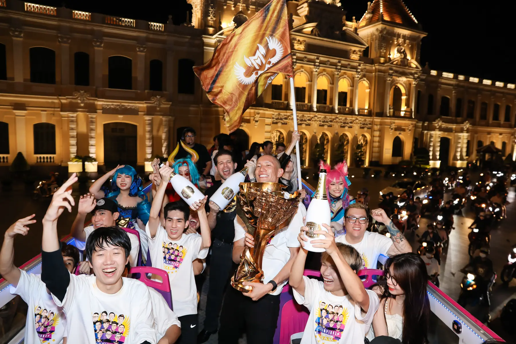 The GAM victory parade bus at City Hall, trophy and flag raised