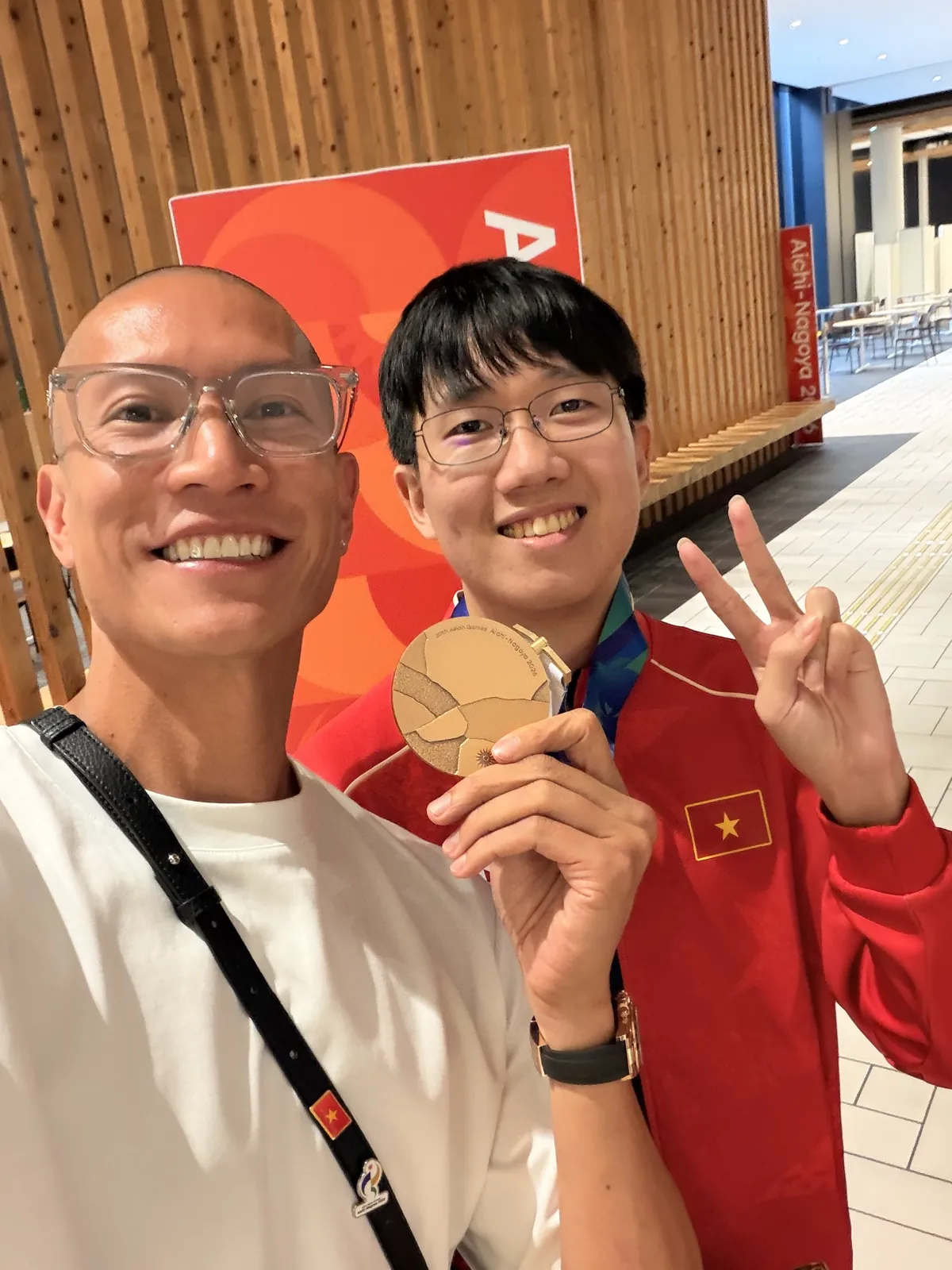 TK Nguyen with a Team Vietnam bronze medallist at the 2026 Asian Games