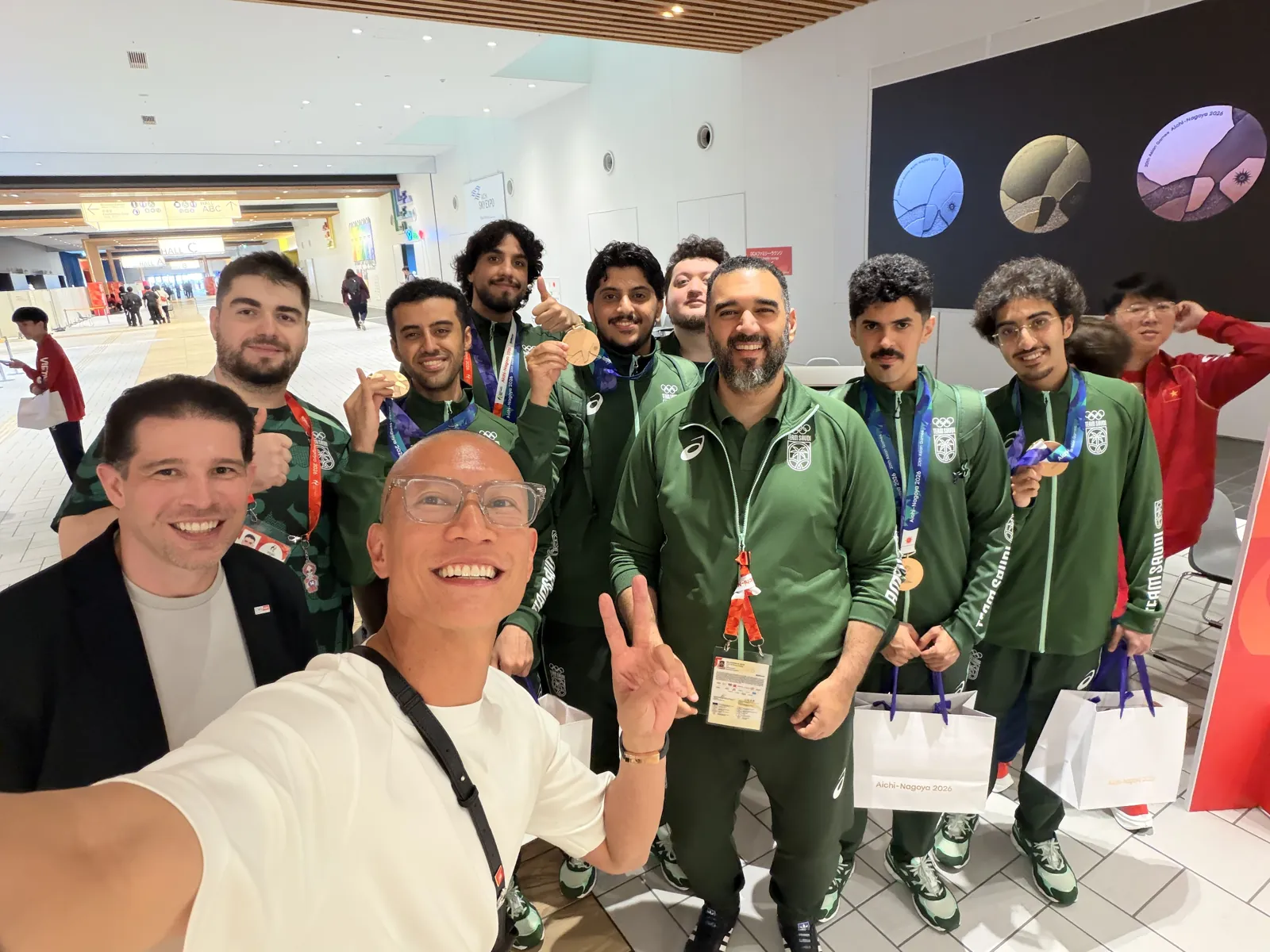 TK Nguyen with Team Saudi Arabia's League of Legends bronze medallists at the 2026 Asian Games