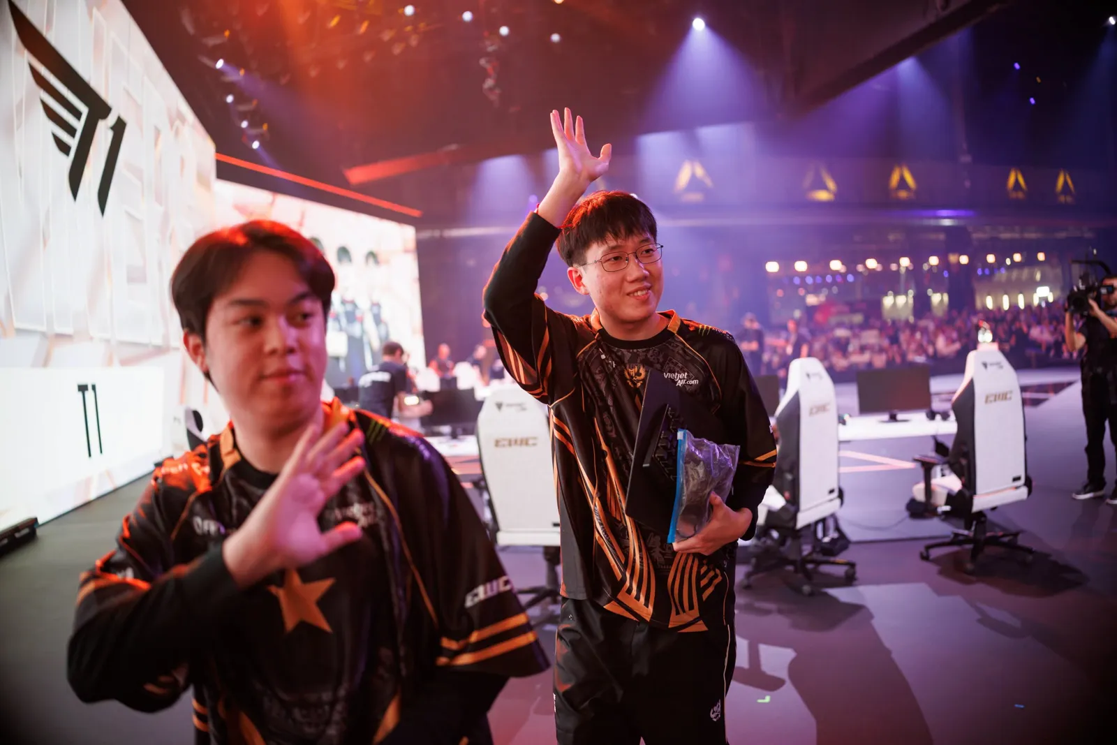 GAM's players wave to the crowd on the Esports World Cup stage